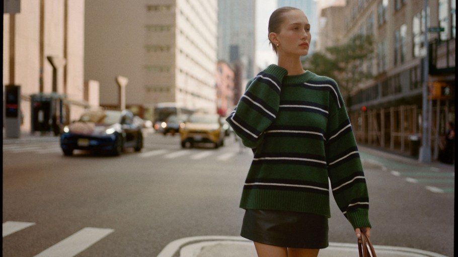 The Reformation Cove Cashmere Oversized Crew sweater in the varsity stripe pattern.
