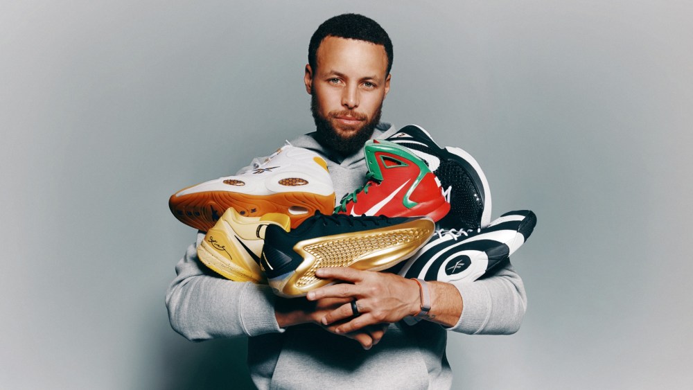 Stephen Curry poses with his sneakers.