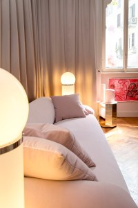 In the main "pink room" she used patchwork offcuts to create a jovial imperfect spherical shape that can be hung from the ceiling. The curation includes Tacchini's new 1809 floor light, the Gianfranco Frattini Grand Sesann sofa and the Torii Love table by Studio Pepe finished in matte powder and pink lacquer.