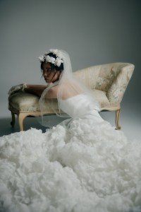 Viktor & Rolf Mariage matte satin and organza Cloud gown; 
Jennifer Behr tulle veil with silk organza flowers; Carolina Amato gloves; David Webb 18-karat gold and platinum carved jade babylon earrings.