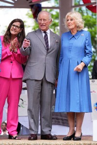 FRONT ROYAL, VIRGINIA - APRIL 30: King Charles III and Queen Camilla and Mayor of Front Royal, Lori Athey Cockrell (L) watch a parade during the community block party on April 30, 2026 in Front Royal, Virginia. King Charles III and Queen Camilla visited the nation's capital, New York City, and Virginia during the trip arranged to celebrate the United States of America's 250th anniversary of its independence. (Photo by Aaron Chown-Pool/Getty Images)