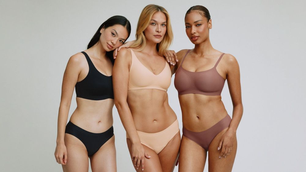 three models posing in knix bras and panties of different colors; best leakproof underwear