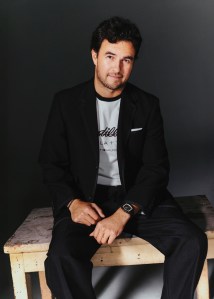 Thom Browne mohair sportcoat and twill trousers. Tommy Hilfiger x Cadillac Formula 1® Team cotton t-shirt.