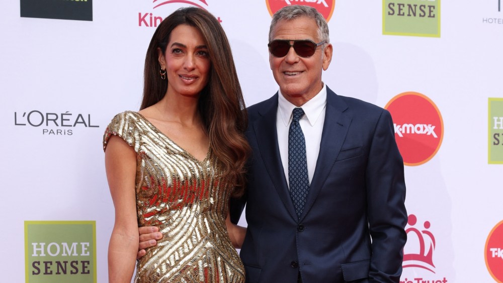 Amal Clooney in McQueen, left, and George Clooney attend A King's Trust Celebration at the Royal Albert Hall on May 11 in London.
