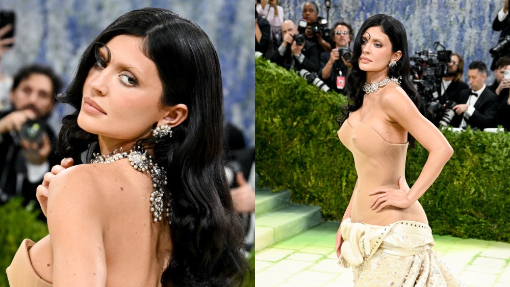 Kylie Jenner arrived at the 2026 Met Gala red carpet in New York City on Monday in a deconstructed look by Schiaparelli.

Kylie Jenner 

Jenner's outfit featured a strapless nude bodysuit with a sweetheart neckline that sits against the skin, creating a barely-there effect through the torso. At the hip, a voluminous cream and ivory ball gown skirt begins, heavily embroidered with delicate floral and botanical details in pale pink, gold, and white, pooling dramatically on the ground. 

Kylie Jenner 

Jenner was styled by Alexandra Rosa and Mackenzie Grandquist for the event.

A wide diamond choker necklace and matching drop earrings complete the look. Dark wavy hair worn loose and bleached eyebrows completed her look.

Kylie Jenner

Jenner made her Met Gala debut in 2016 in a silver Balmain gown for the "Manus x Machina: Fashion in an Age of Technology" theme. She has attended most years, wearing an Alexander Wang gown in 2018, a colorful showgirl-inspired look alongside sister Kendall Jenner in 2019, an Off-White wedding dress by the late Virgil Abloh in 2022, a pearl-colored Givenchy archive gown in 2024, and a Ferragamo halter dress in 2025.

Kylie Jenner at The 2026 Met Gala Celebrating "Costume Art" held at The Metropolitan Museum of Art on May 04, 2026 in New York, New York.