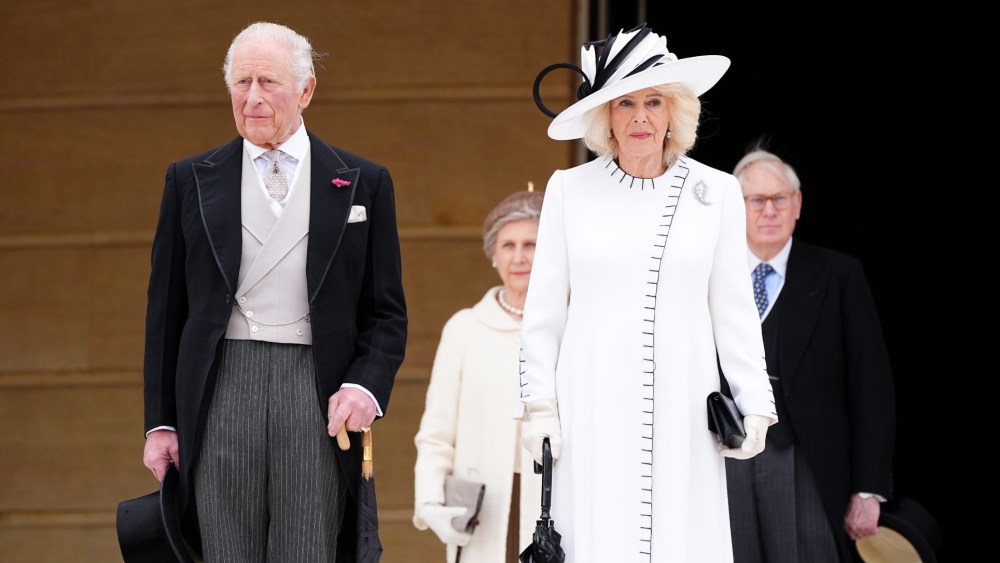 Queen Camilla wears Anna Valentine at a Royal Garden Party at Buckingham Palace on May 12 in London.