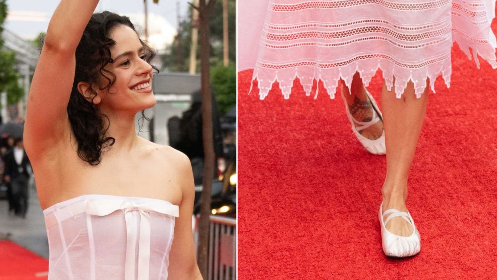 Rosalía wearing a pair of white ruched ballet flats on the red carpet for  Netflix’s “La Jarana en el Guadalquivir” in Seville, Spain on Saturday.